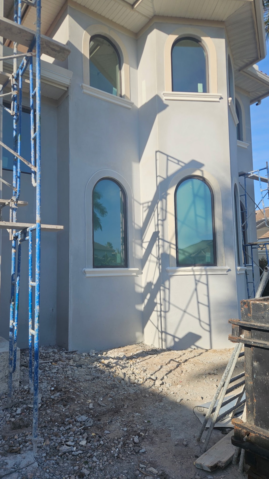 Smooth stucco finish with decorative window trim